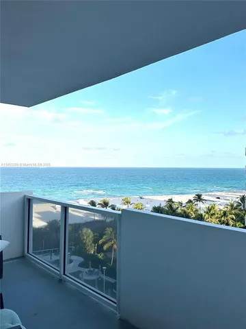 a view of roof deck with wooden floor and dining space