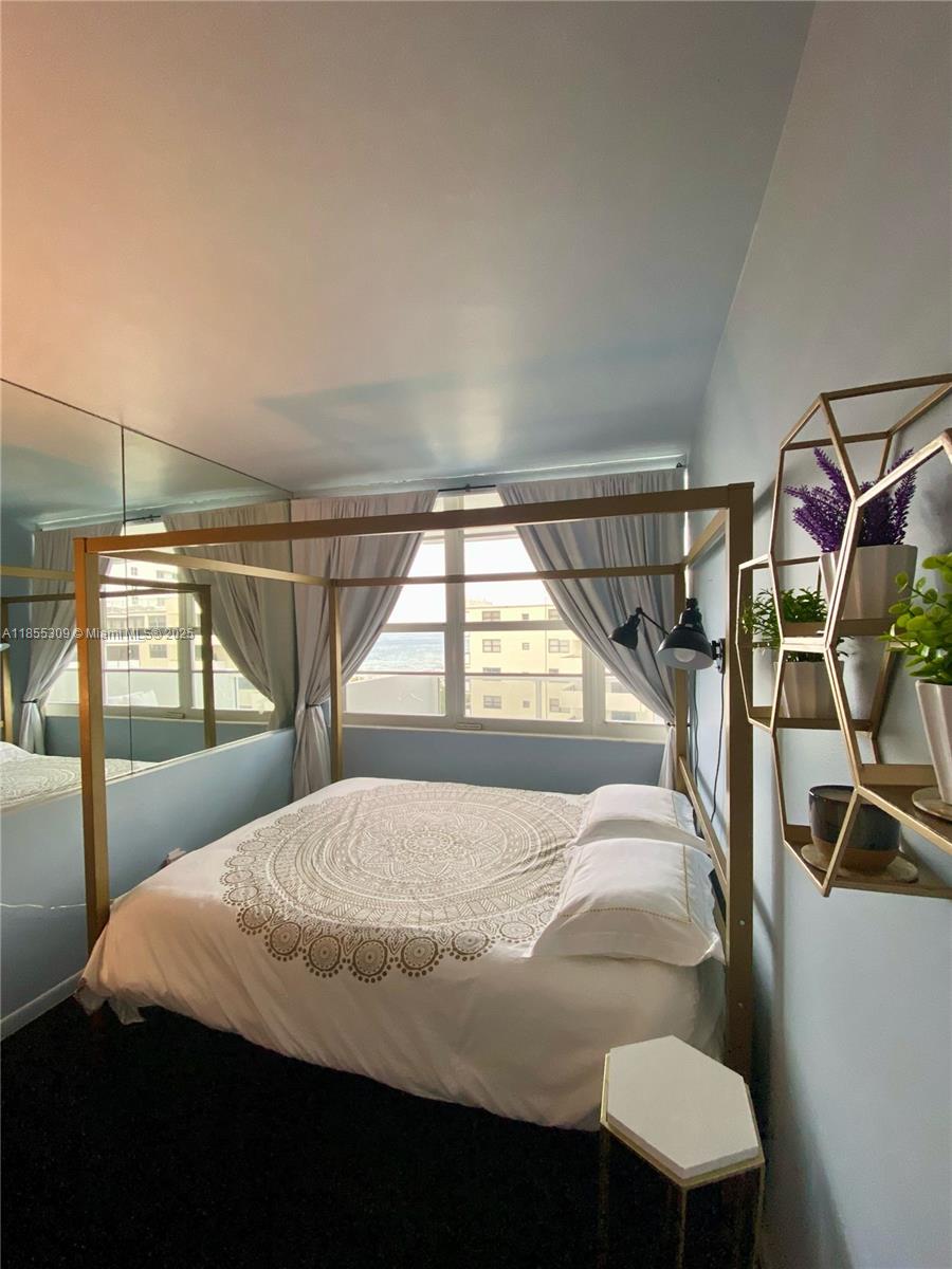 100 Lincoln Road, Unit 936 Miami Beach, FL 33139 - Photo 8 of 8 a bedroom with a bed and window