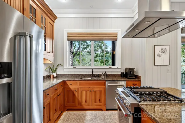 a kitchen with a stove a sink and a refrigerator
