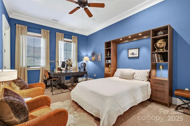 a bedroom with furniture and windows