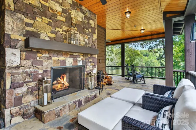 a living room with fireplace furniture and a flat screen tv