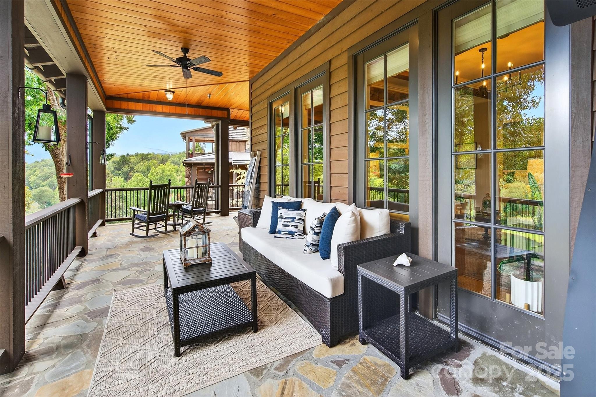 275 Clubhouse, Unit C202 Mill Spring, NC 28756 - Photo 30 of 48 a living room with furniture and a large window