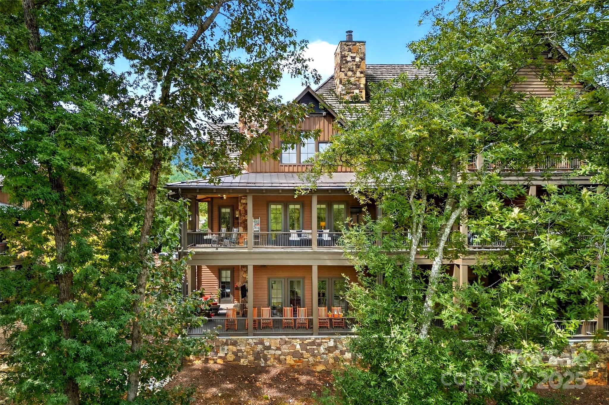 275 Clubhouse, Unit C202 Mill Spring, NC 28756 - Photo 36 of 48 front view of a house with a small yard