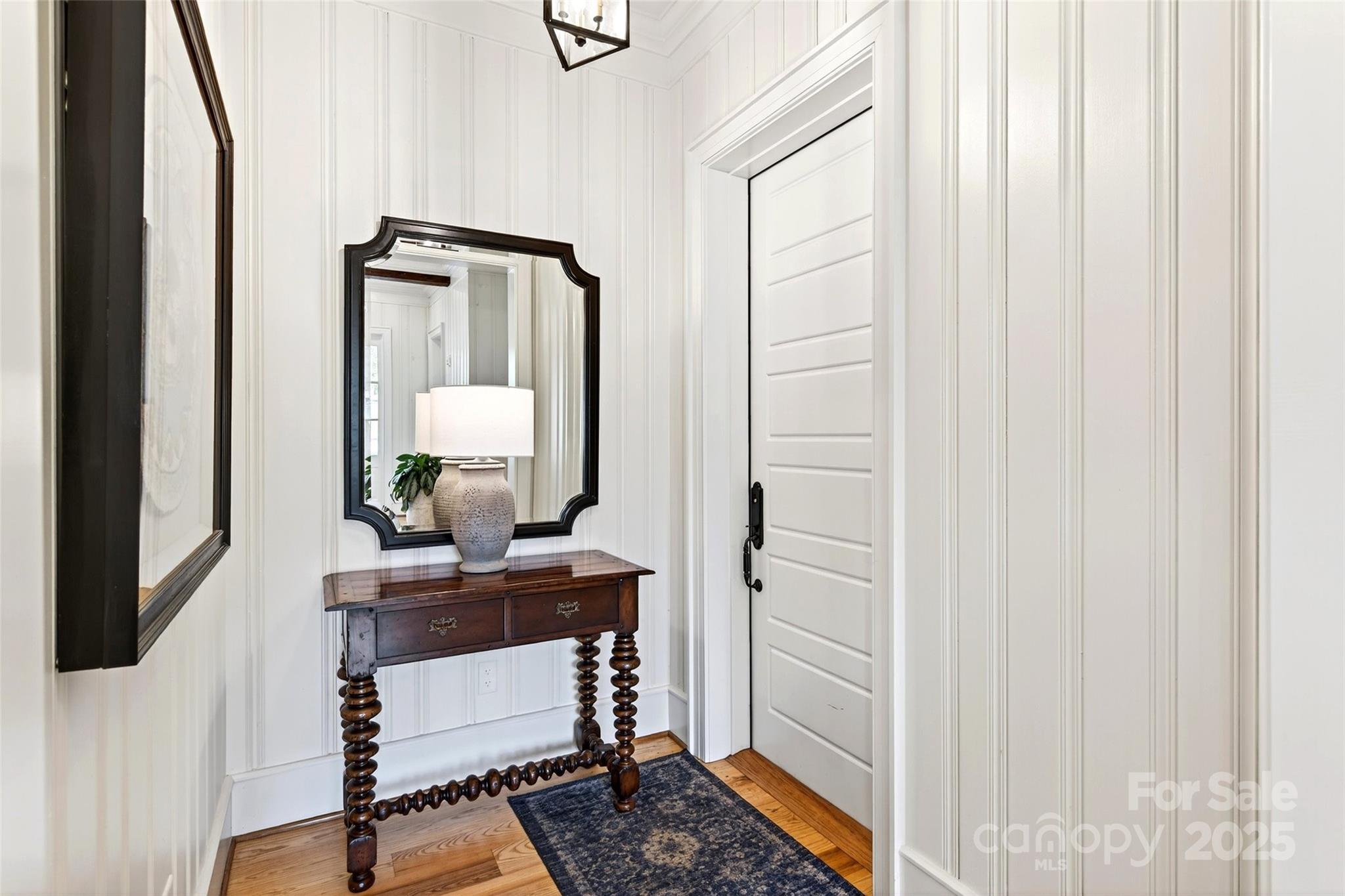 275 Clubhouse, Unit C202 Mill Spring, NC 28756 - Photo 4 of 48 a room with a table and a mirror