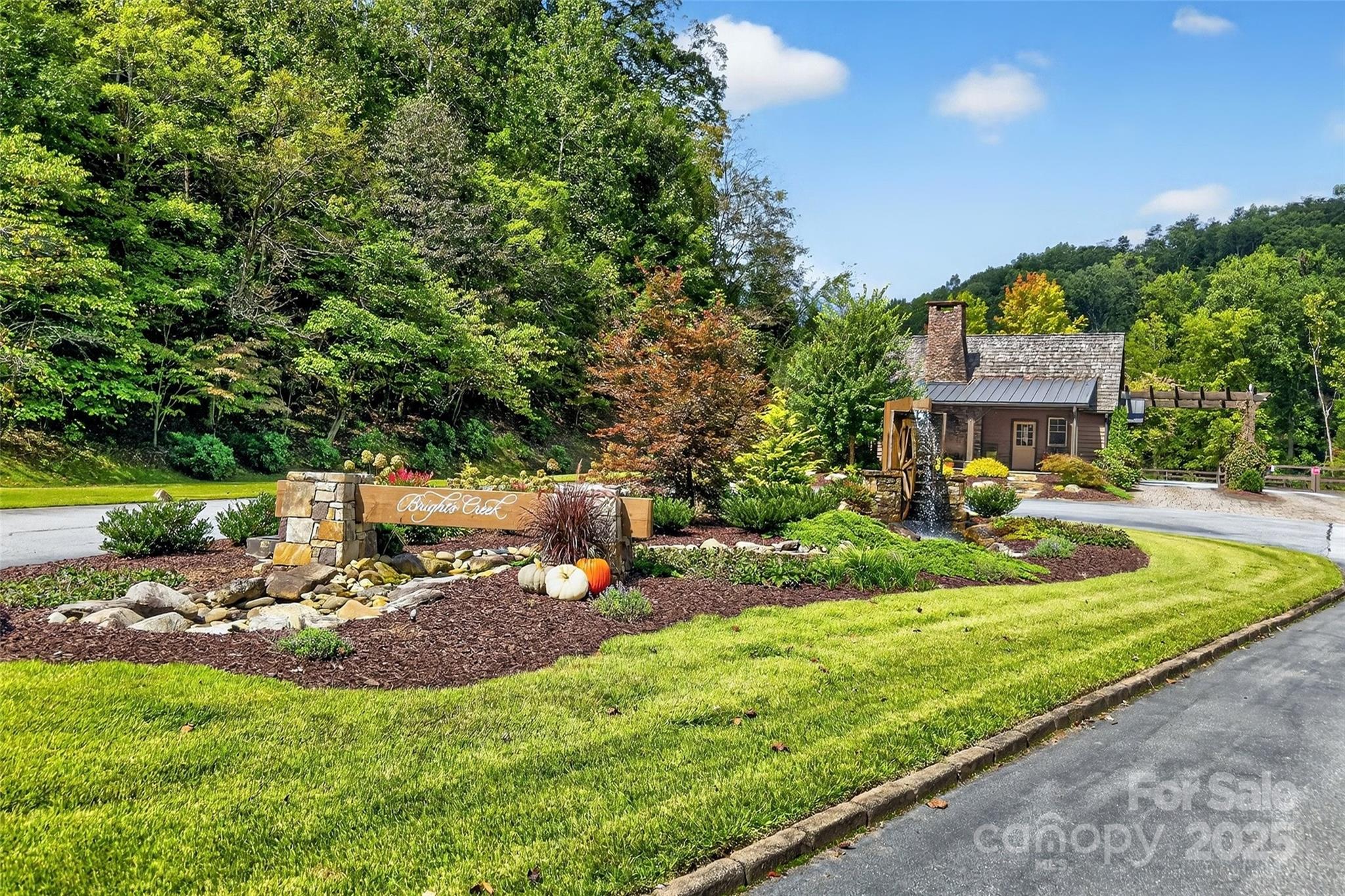 275 Clubhouse, Unit C202 Mill Spring, NC 28756 - Photo 46 of 48 a view of a house with backyard and sitting area