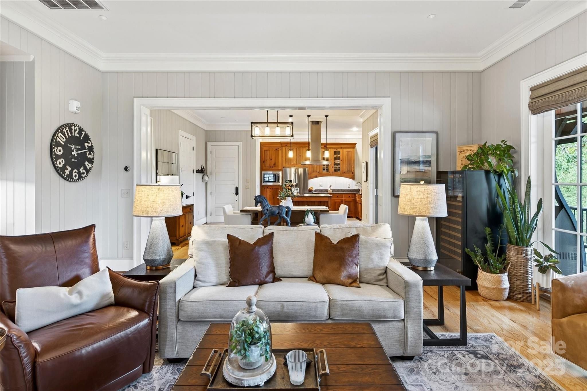 275 Clubhouse, Unit C202 Mill Spring, NC 28756 - Photo 9 of 48 a living room with furniture and a floor to ceiling window