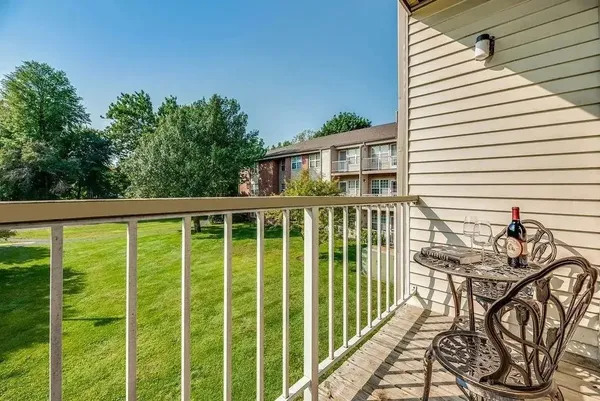 a view of a house with backyard and deck