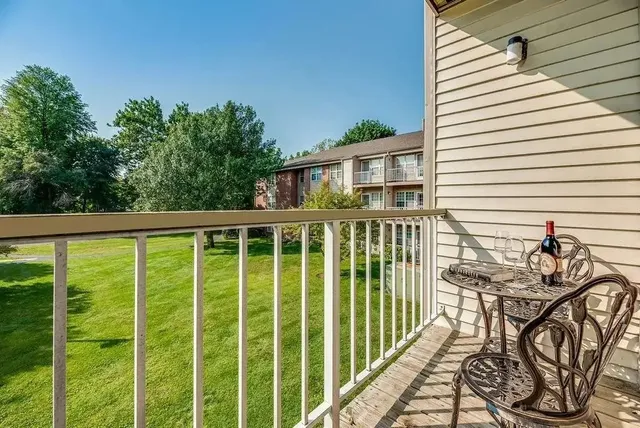 a view of a house with backyard and deck