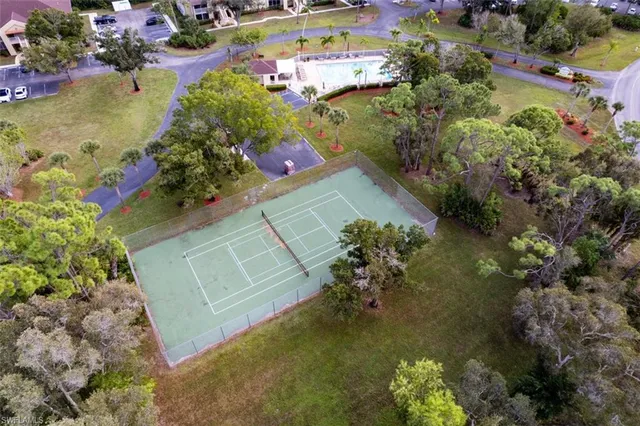 a white toilet sitting next to a bathroom sink and tub