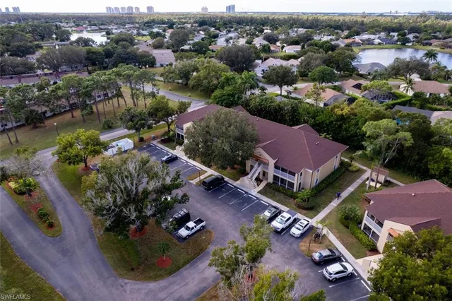an aerial view of a houses with a yard