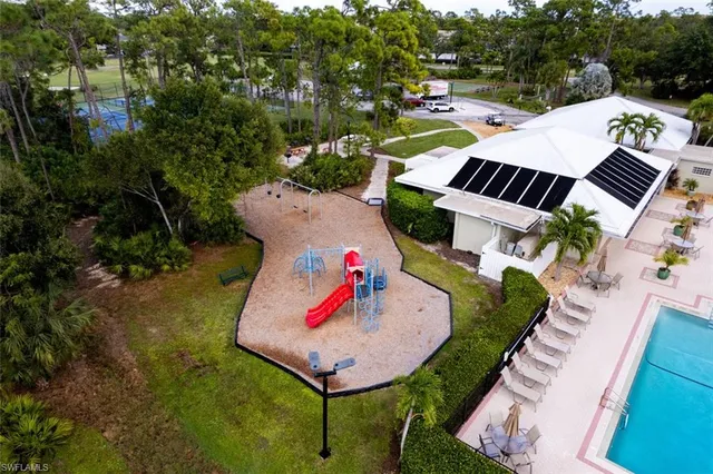 an aerial view of house with yard and outdoor seating