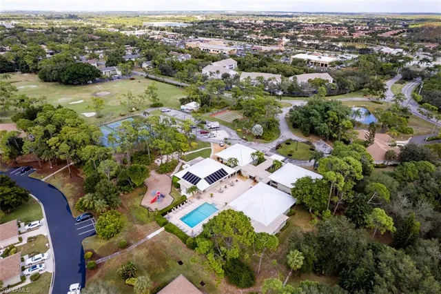 an aerial view of residential house with outdoor space and lake view