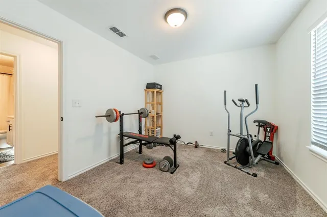 a view of a room with gym equipment