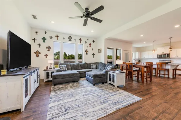 a living room with furniture and a flat screen tv