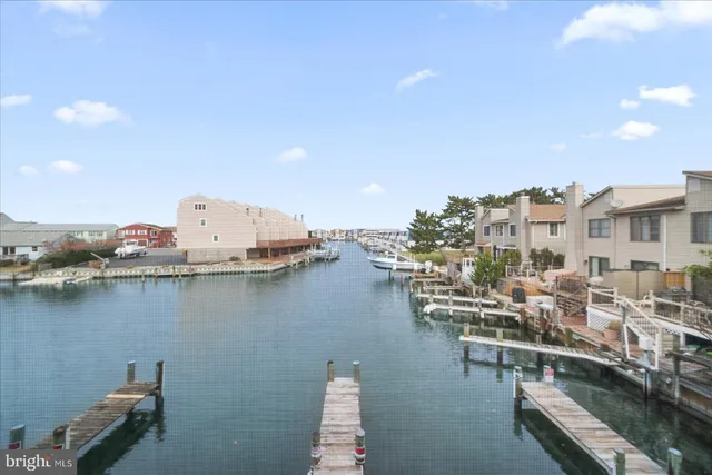 a view of a lake with chairs