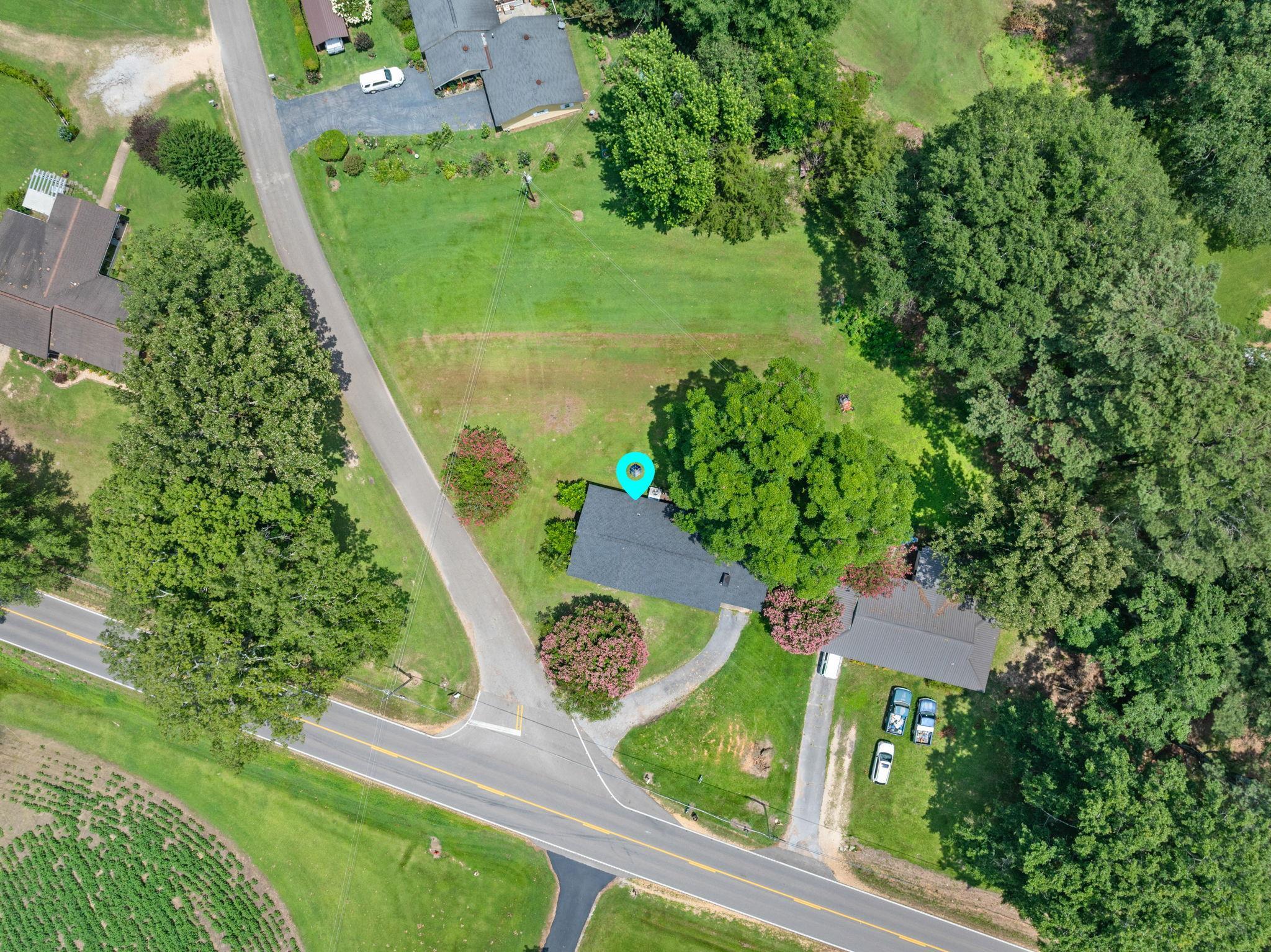 217 Red Bay Road Golden, MS 38847 - Photo 25 of 33 Aerial perspective showcasing a property surrounded by mature trees
