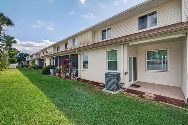 an aerial view of a house with a lake view
