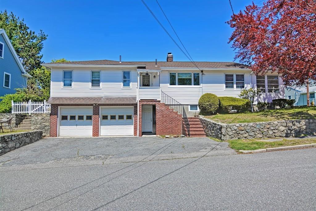 20 Westvale Road Medford, MA 02155 - Photo 1 of 42 a front view of a house with a yard and potted plants