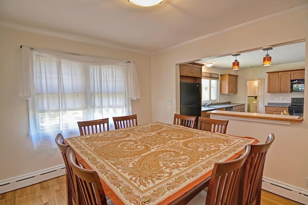 20 Westvale Road Medford, MA 02155 - Photo 13 of 42 a view of a dining room with furniture and a kitchen