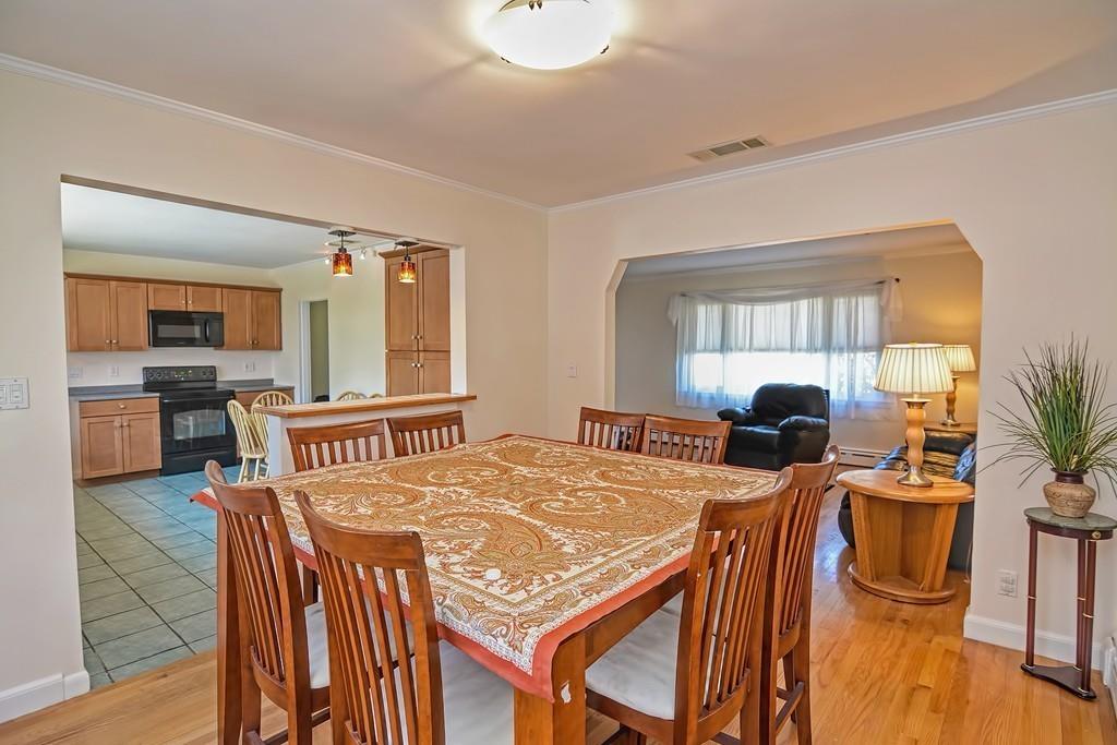 20 Westvale Road Medford, MA 02155 - Photo 14 of 42 a view of a dining room with furniture and wooden floor