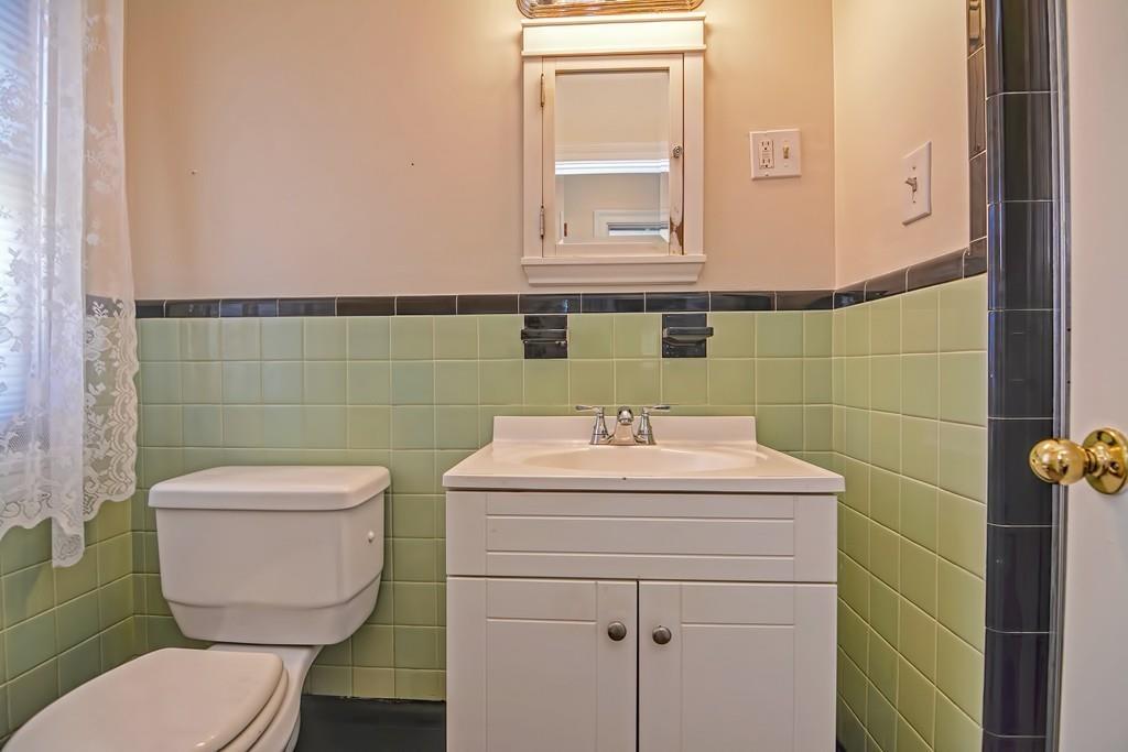 20 Westvale Road Medford, MA 02155 - Photo 17 of 42 a bathroom with a toilet a sink and mirror