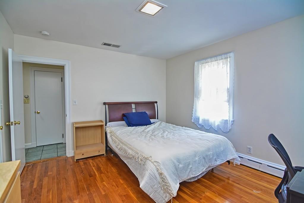 20 Westvale Road Medford, MA 02155 - Photo 23 of 42 a bedroom with a bed and a window