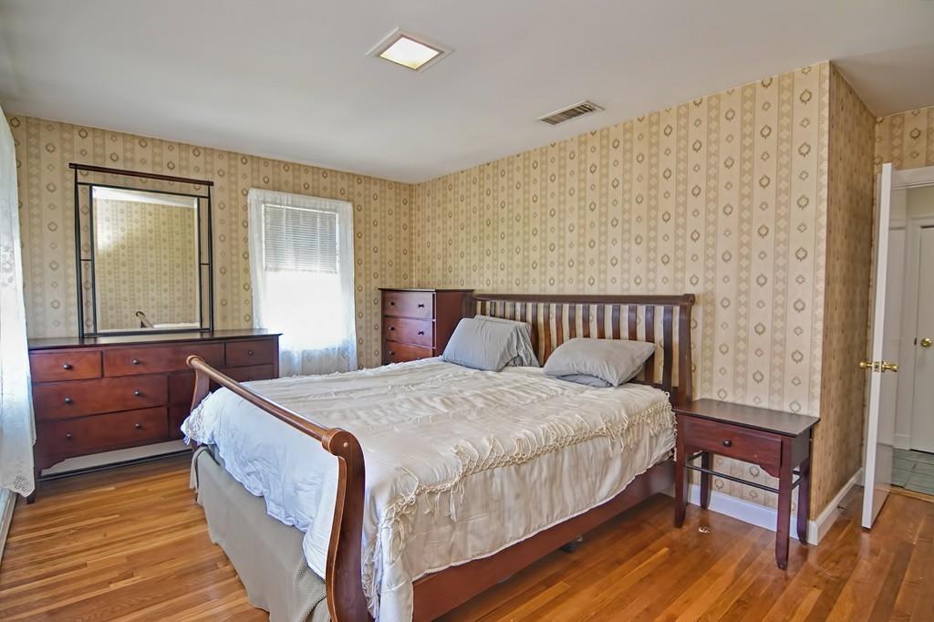 20 Westvale Road Medford, MA 02155 - Photo 29 of 42 a bedroom with bed and wooden floor