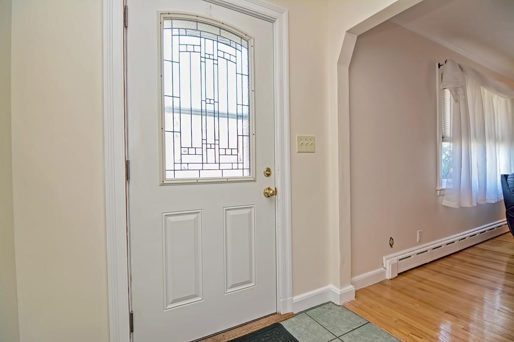 20 Westvale Road Medford, MA 02155 - Photo 7 of 42 a view of an empty room with wooden floor and a window
