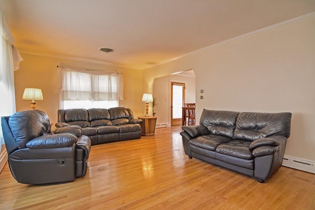 20 Westvale Road Medford, MA 02155 - Photo 8 of 42 a living room with furniture and a wooden floor