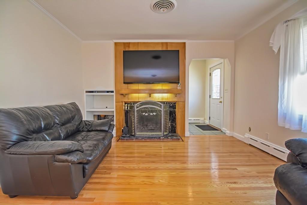 20 Westvale Road Medford, MA 02155 - Photo 9 of 42 a living room with furniture and a fireplace