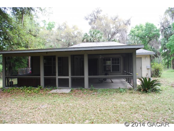 22868 Northwest 91st Court Road Micanopy, FL 32667 - Photo 9 of 12 Covered Lanai