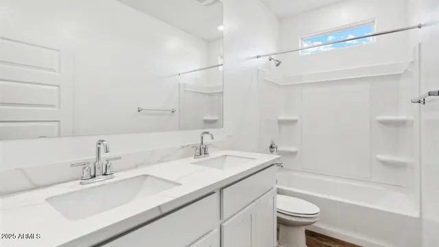 a bathroom with a sink double vanity granite toilet tub and shower