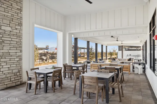 a view of a dining area with furniture and chandelier