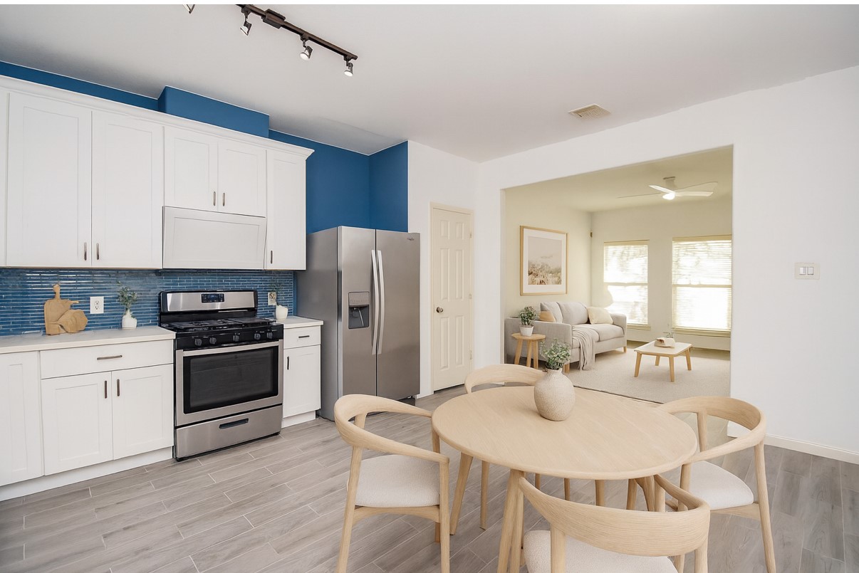2202 Naomi Street, Unit 3 Houston, TX 77054 - Photo 11 of 42 a kitchen with stainless steel appliances a stove a sink dishwasher a refrigerator with a dining table and chairs