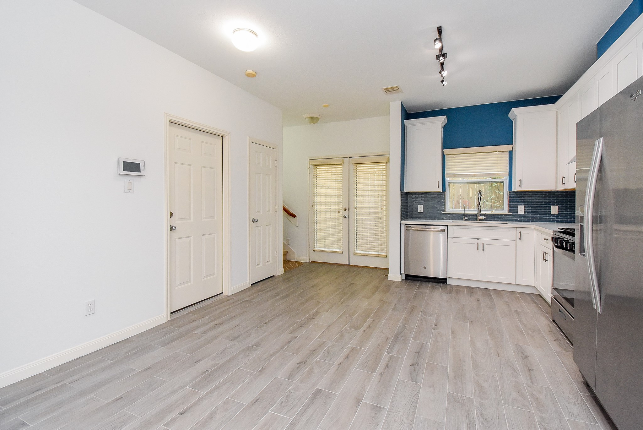 2202 Naomi Street, Unit 3 Houston, TX 77054 - Photo 18 of 42 a large kitchen with a wooden floor and cabinets