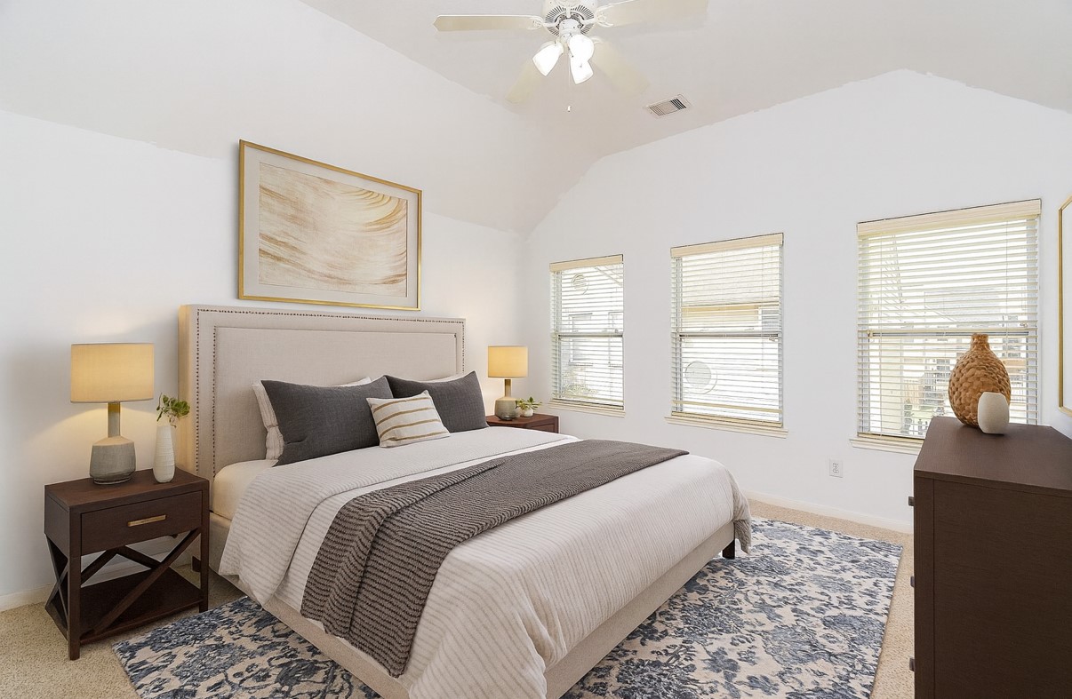 2202 Naomi Street, Unit 3 Houston, TX 77054 - Photo 29 of 42 a bedroom with a bed and wooden floor