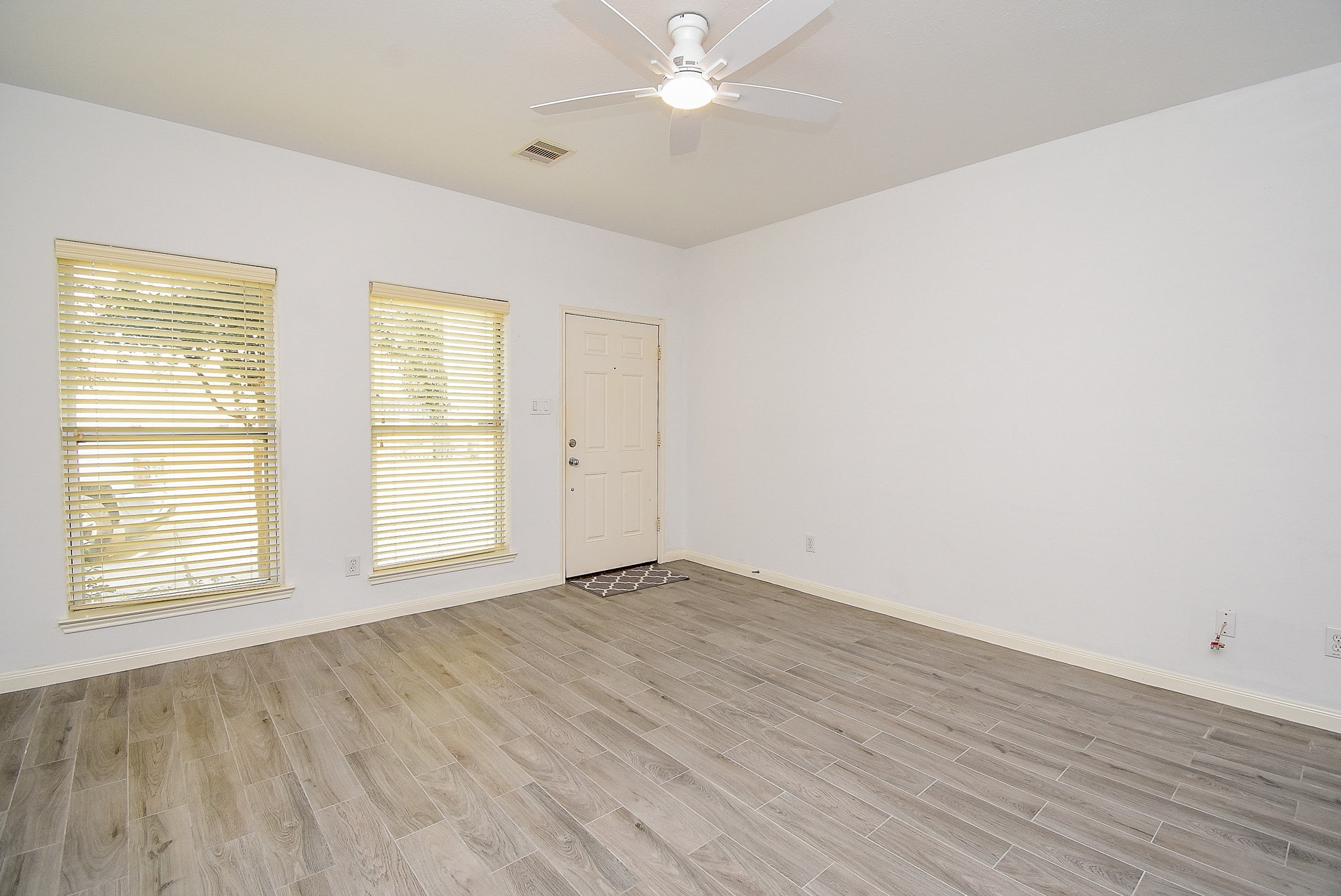 2202 Naomi Street, Unit 3 Houston, TX 77054 - Photo 5 of 42 wooden floor in an empty room with a window