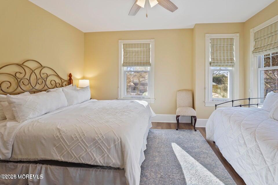 200 Monmouth Avenue, Unit 21 Spring Lake, NJ 07762 - Photo 5 of 25 a bedroom with a bed and a night stand