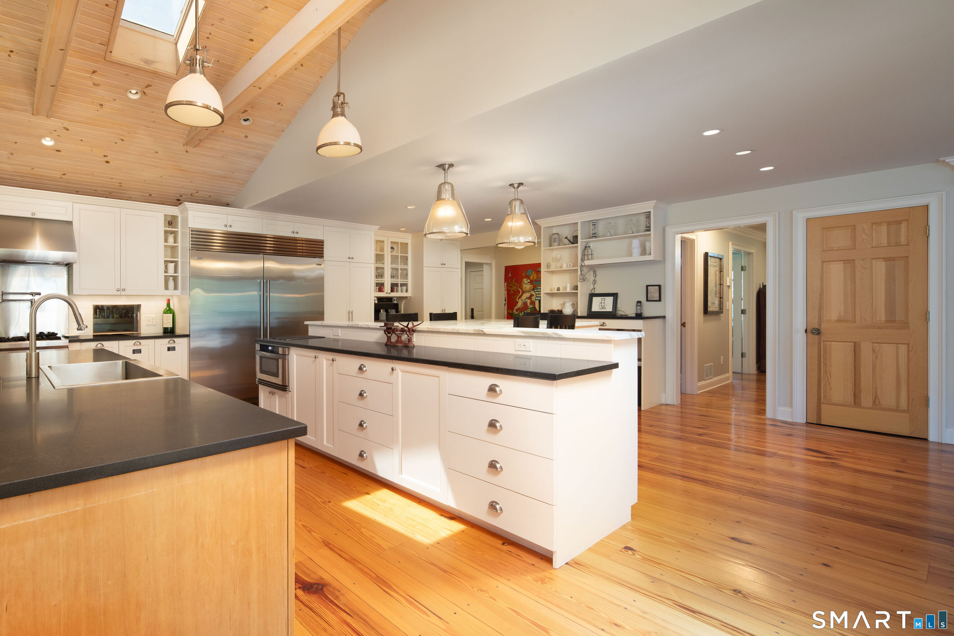 7 Cooper Hill Road Salisbury, CT 06068 - Photo 11 of 36 a large kitchen with stainless steel appliances kitchen island a large counter top and a wooden floors