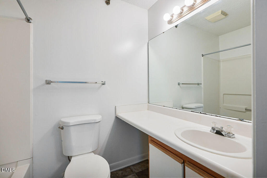 1411 Collegiate Circle, Unit 302 Raleigh, NC 27606 - Photo 17 of 43 a bathroom with a sink toilet and shower