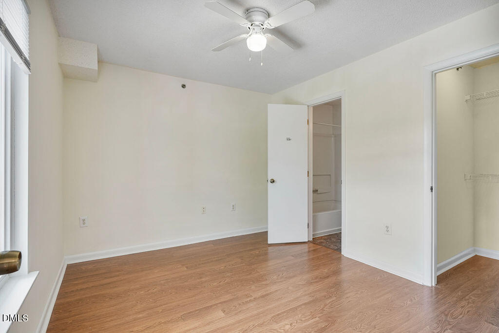 1411 Collegiate Circle, Unit 302 Raleigh, NC 27606 - Photo 30 of 43 a view of an empty room with wooden floor