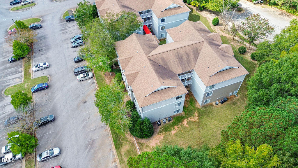 1411 Collegiate Circle, Unit 302 Raleigh, NC 27606 - Photo 39 of 43 an aerial view of a house with a yard and garden