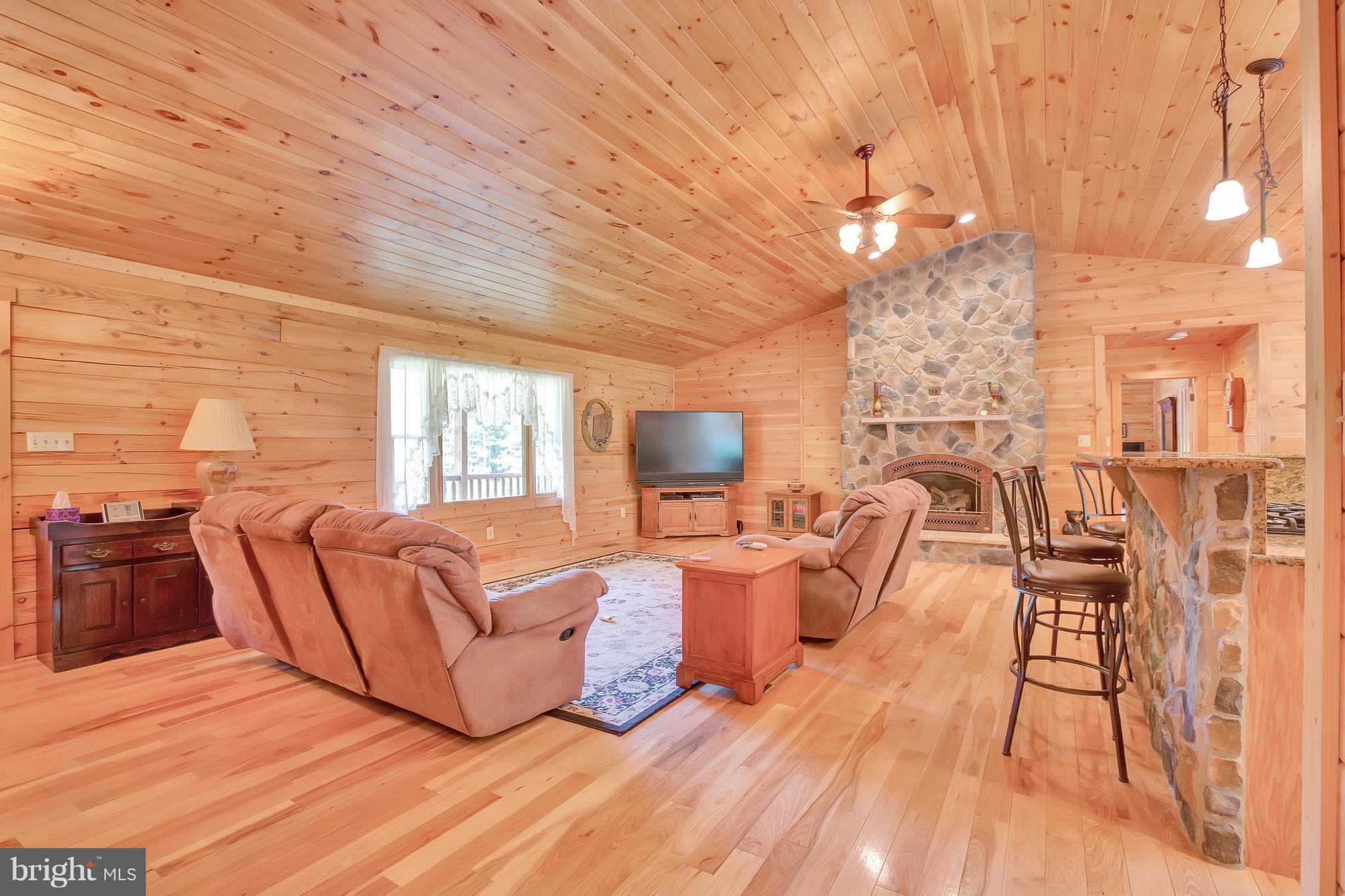 14311 Crawleys Dam Road Goldvein, VA 22720 - Photo 9 of 30 Great Room off Kitchen w Exquisite Stone Fireplace