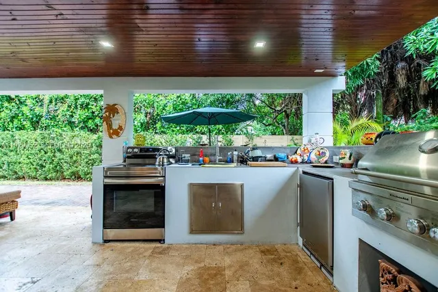 a kitchen with stainless steel appliances granite countertop a stove and a sink