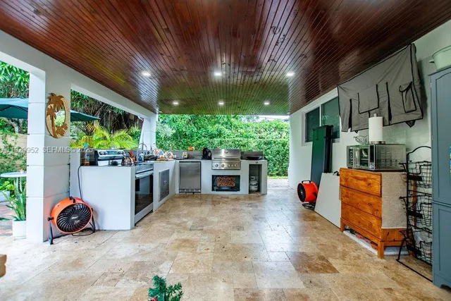 a view of an outdoor space with porch and furniture