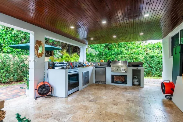 a view of an chairs and tables in the patio
