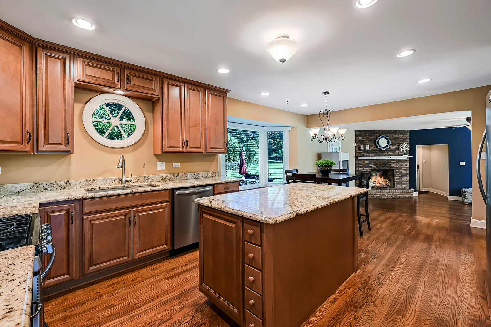 2 Carriage Lane Lemont, IL 60439 - Photo 11 of 44 a kitchen with a sink cabinets and wooden floor