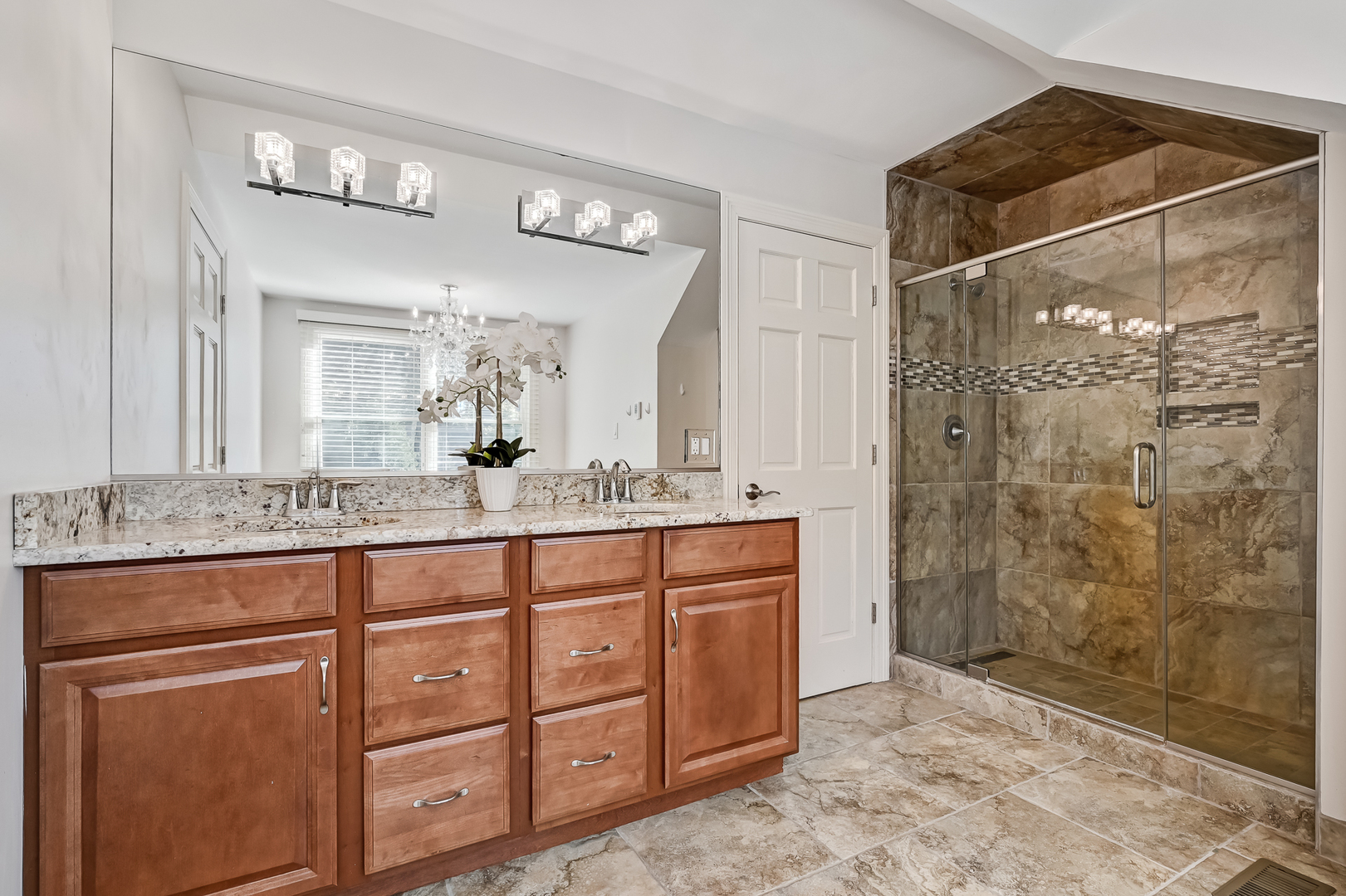 2 Carriage Lane Lemont, IL 60439 - Photo 29 of 44 a bathroom with a granite countertop sink mirror and shower