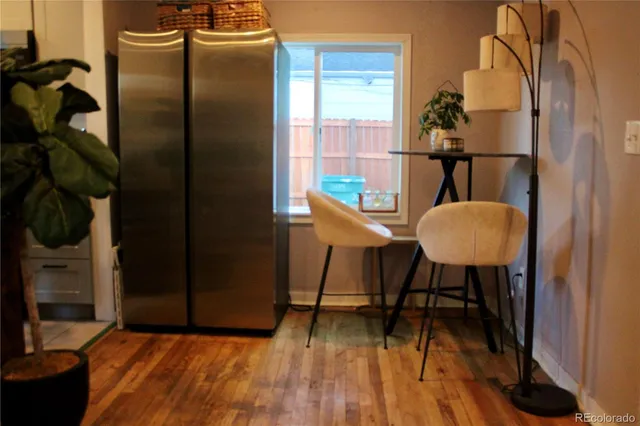 a workspace room with furniture and wooden floor