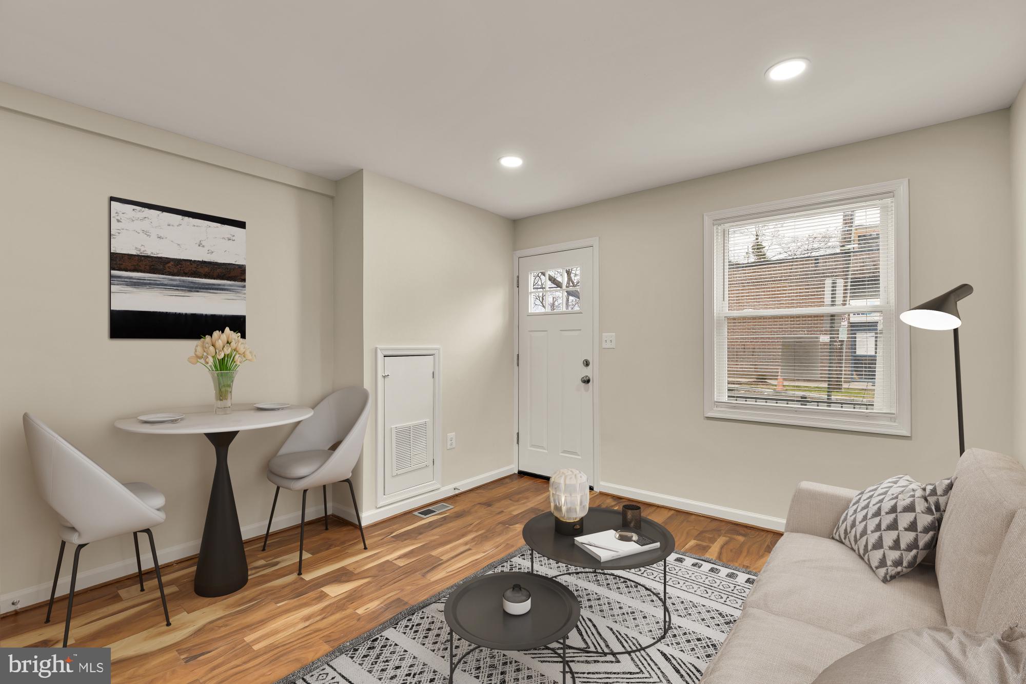 4131 Hunt Place Northeast, Unit A Washington, DC 20019 - Photo 4 of 9 a living room with furniture and wooden floor
